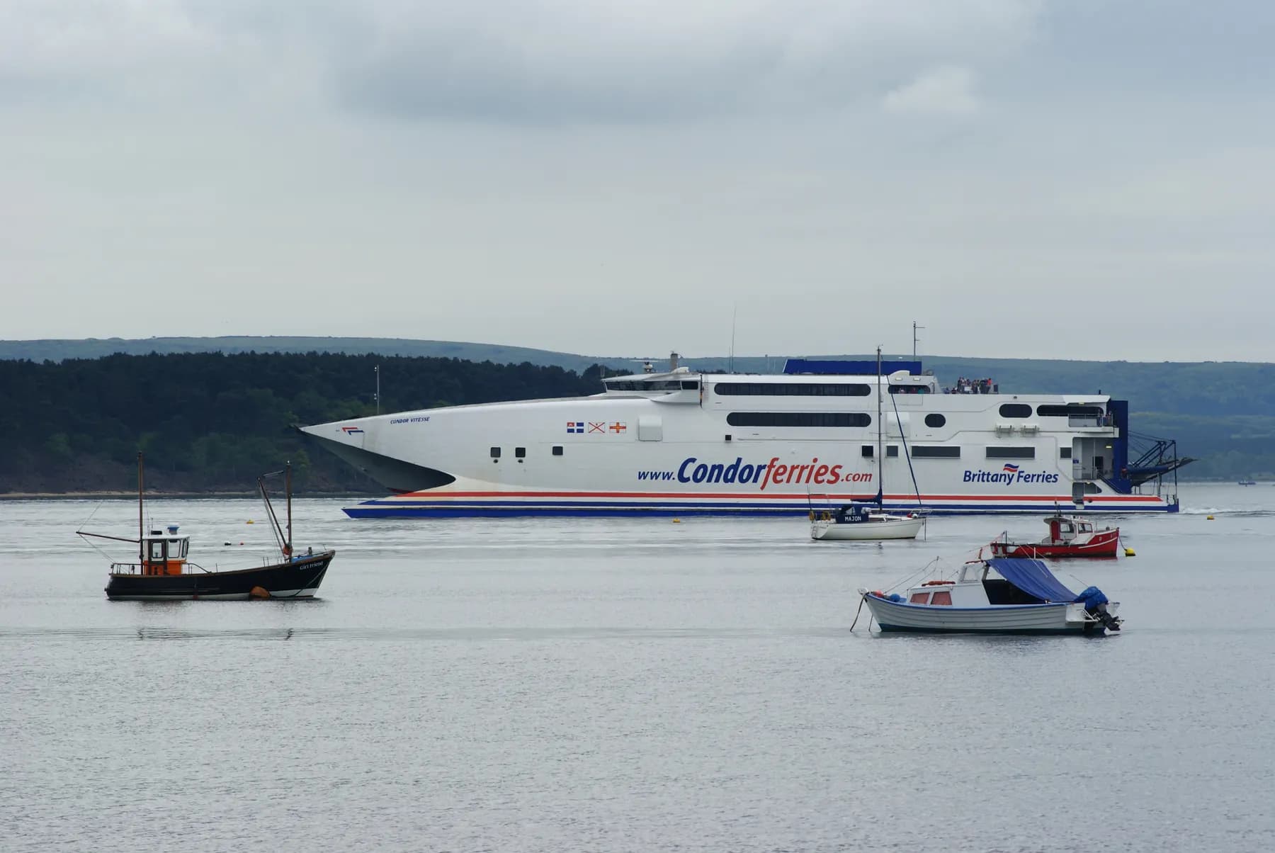 Poole Harbour, with boats moored along the waterfront